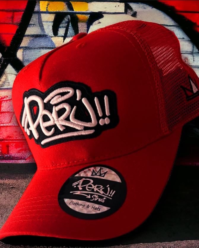 Red mesh trucker cap with Perú graffiti tag patch